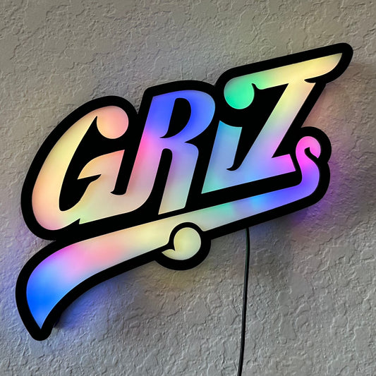 GRiZ sign lit in rainbow colors, which fade into each other.