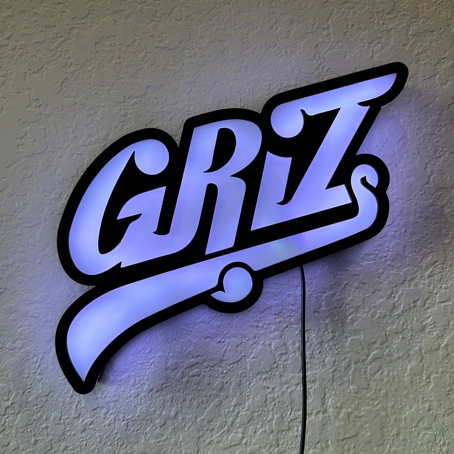 GRiZ LED sign lit up in solid white.